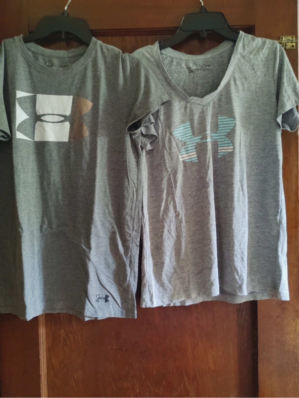 3 shirts Under Armour (2 Gray and 1 orange) Short Sleeve Tee with Logo